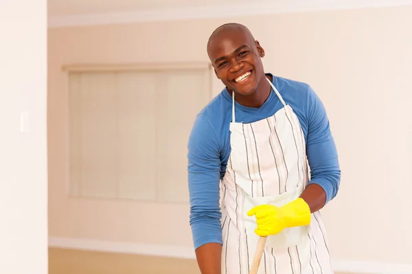 Man cleaning bedroom — Stock Photo, Image