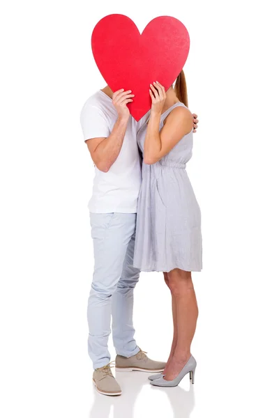 Casal segurando símbolo coração — Fotografia de Stock