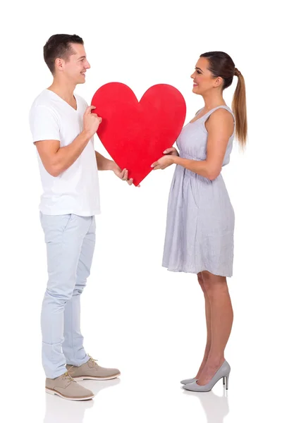 Couple holding heart symbol Stock Image