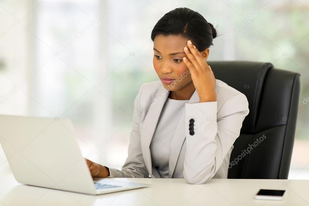businesswoman looking at laptop screen