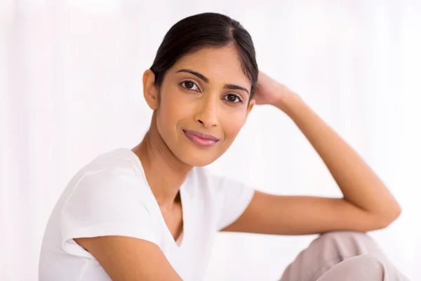 Woman sitting at home Royalty Free Stock Images