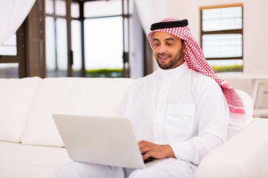muslim man using laptop clipart