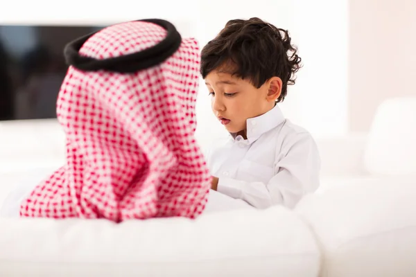 Father and son sitting at home — Stock Photo, Image