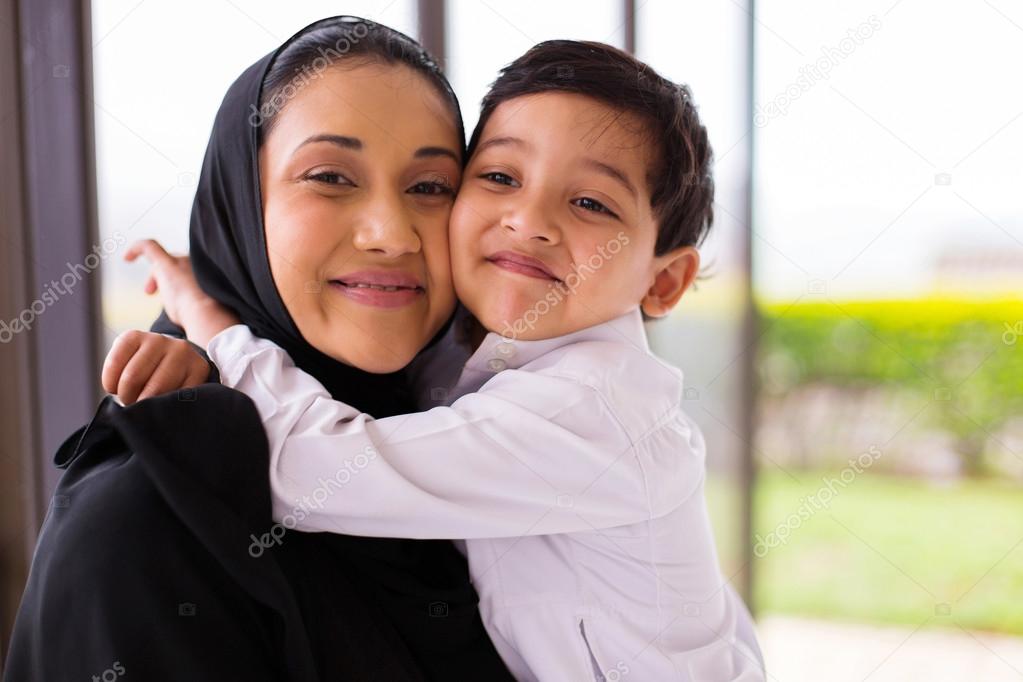 boy hugging mother