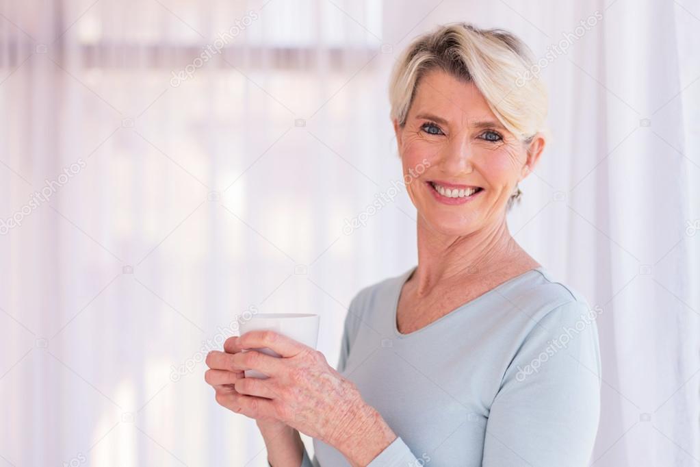 senior woman having coffee