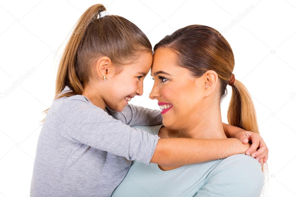 embracing mother and daughter