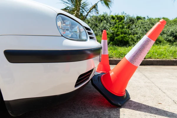 Car bumping traffic cones — Stock Photo, Image