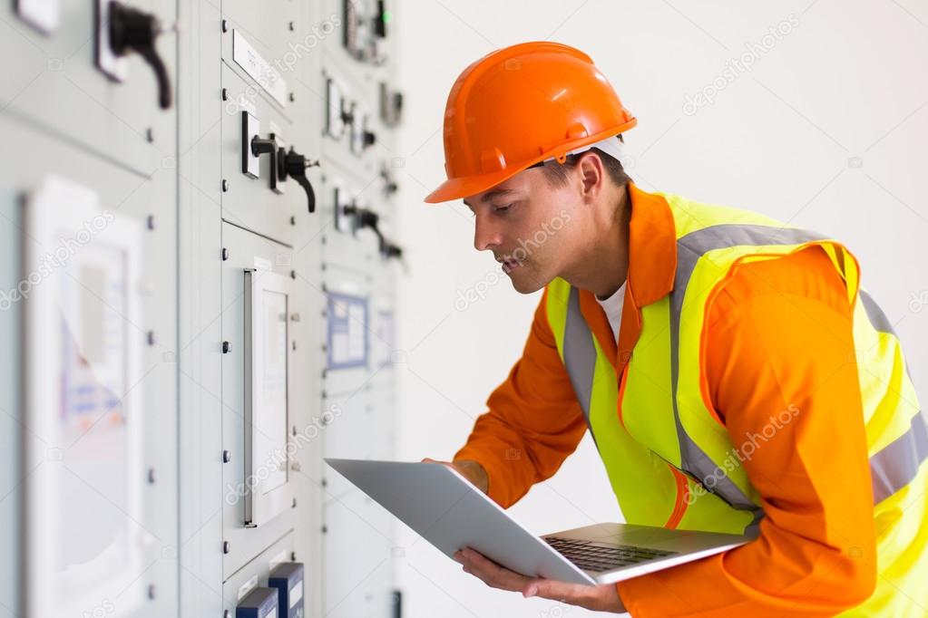 technical worker using laptop computer