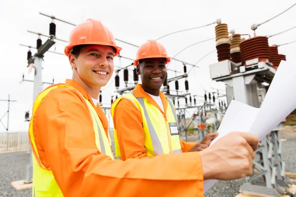 Electricians holding blueprint — Stock Photo, Image