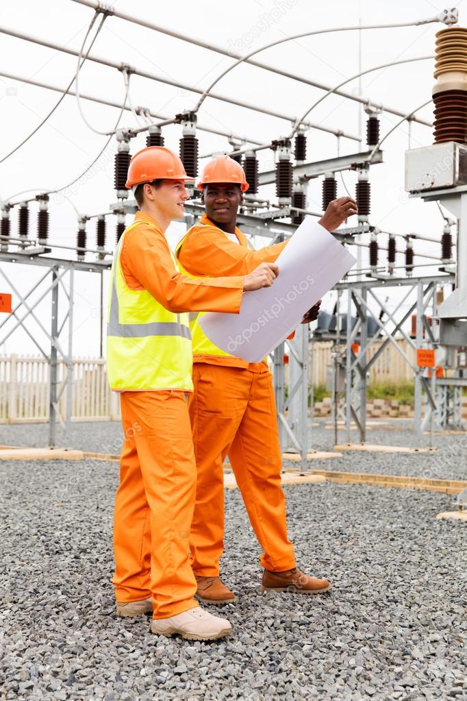 electricians holding blueprint