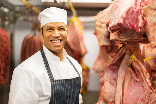 Butcher standing in butchery — Stock Photo, Image
