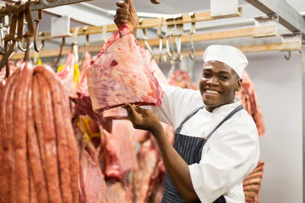 Butcher in cold room — Stock Photo, Image