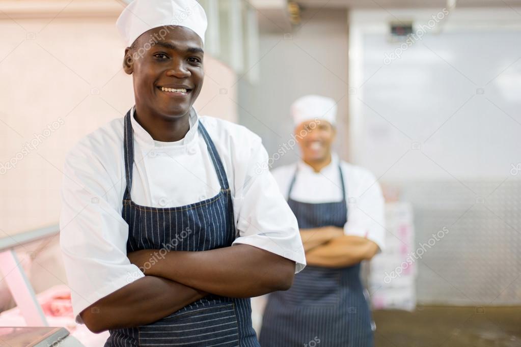 african american butcher with colleague