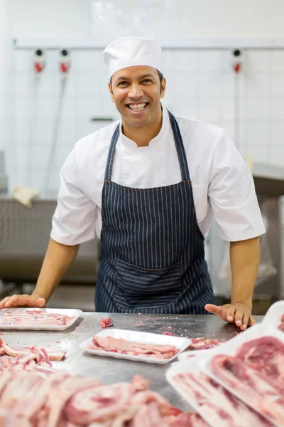 Butcher working in butcher-shop — Stock Photo, Image