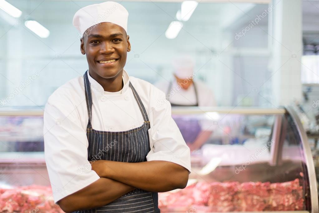 afro american butcher with arms folded