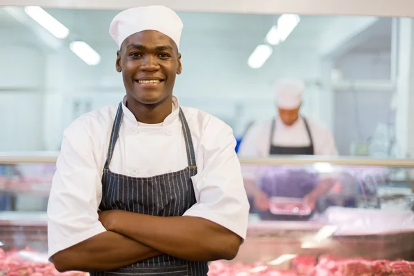 Açougueiro afro-americano com braços dobrados — Fotografia de Stock