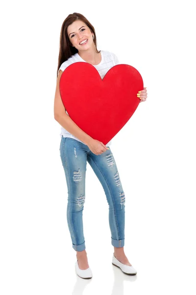 Kobieta trzyma kształt serca — Zdjęcie stockowe