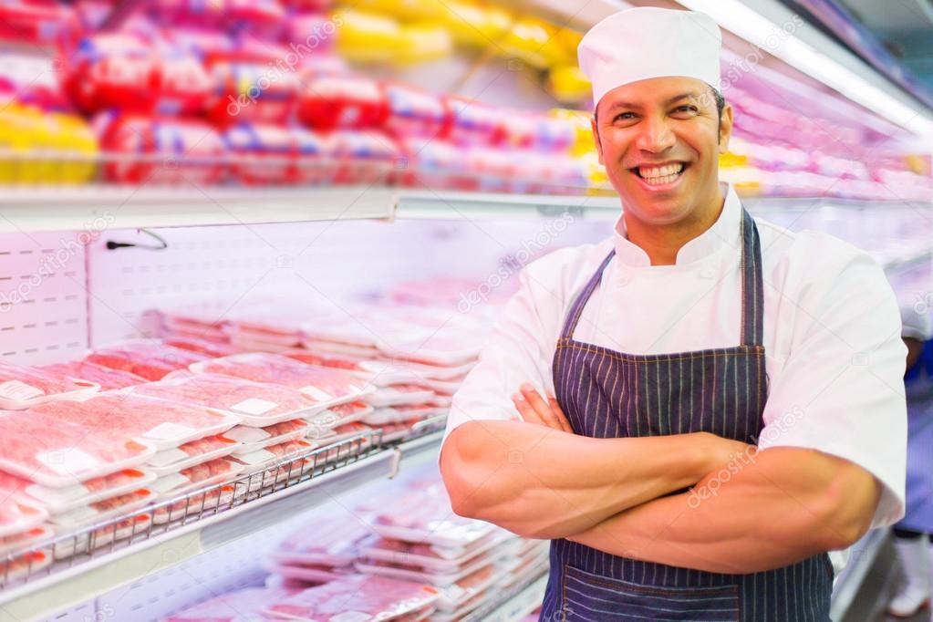 male butcher with arms folded