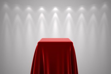 Kırmızı ipek ve spot ışığı ile ayaklı