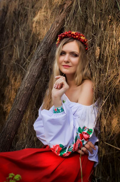 Ukrainian beautiful woman in the hayloft — Stock Photo, Image