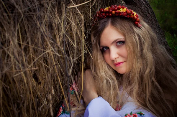 Ukrainian beautiful woman in the hayloft — Stock Photo, Image