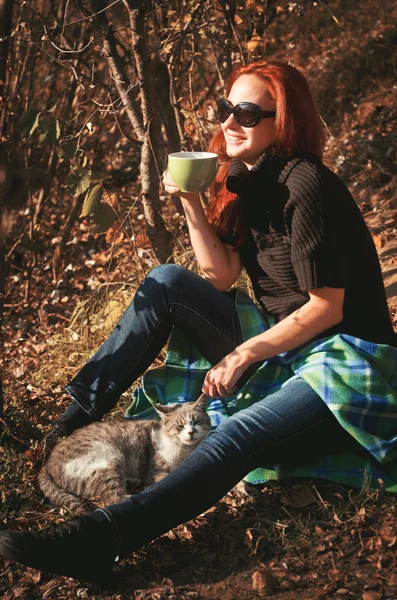 The woman went out for a walk in the park with a cat — Stock Image The woman went out for a walk in the park with a cat Royalty Free Stock Images
