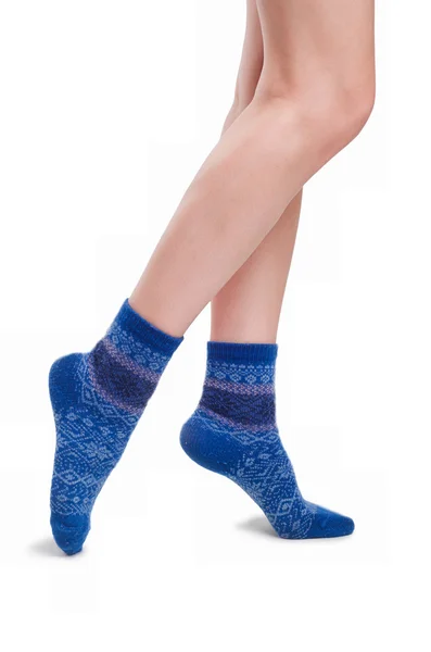 Perfect female legs in blue knitted socks — Stock Photo, Image