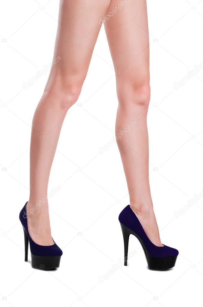 Perfect female legs wearing high heels