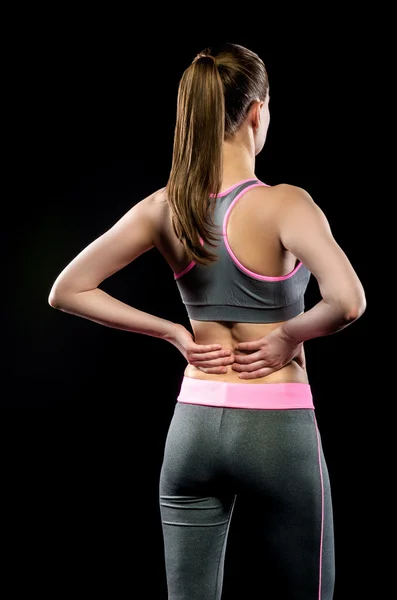 Sportlerin hält sich nach unsachgemäßer Behandlung am wunden Punkt fest — Stockfoto