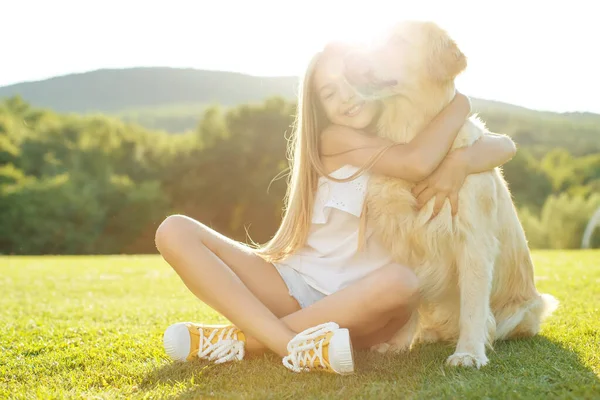 Teenager girl with a dog in nature. — Stock Photo, Image