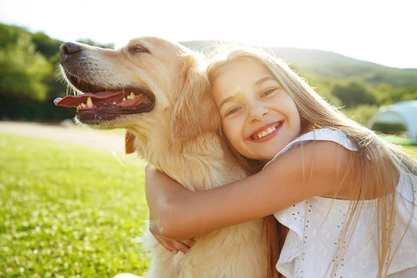 Teenager girl with a dog in nature. — Stock Photo, Image