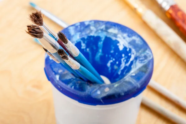 Paintbrushes on palette. — Stock Photo, Image