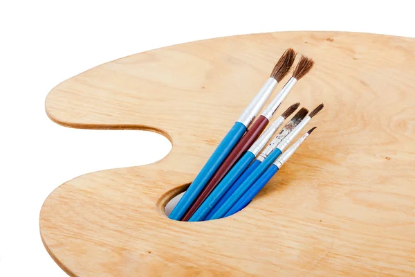 Paintbrushes on palette. — Stock Photo, Image