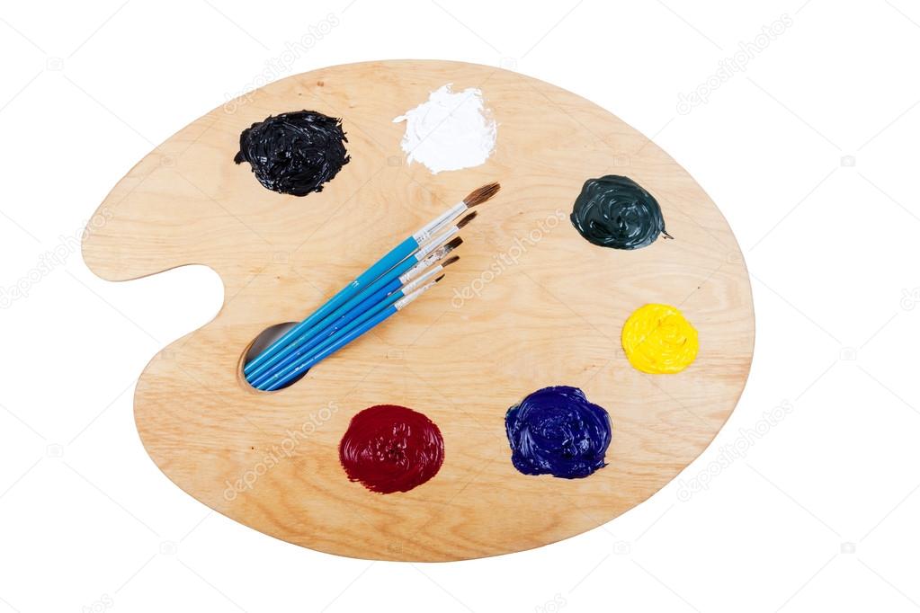 Palette with oil paint and brushes