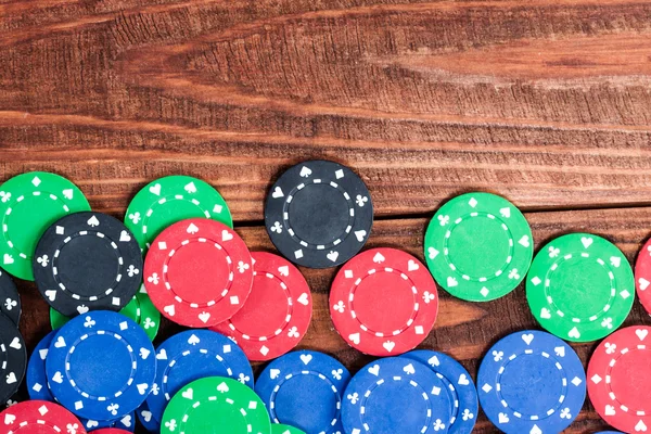 Poker chips over wooden background — Stock Photo, Image