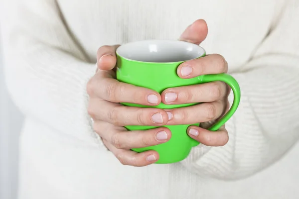 Cup of tea or coffee in female hands — Stock Photo, Image