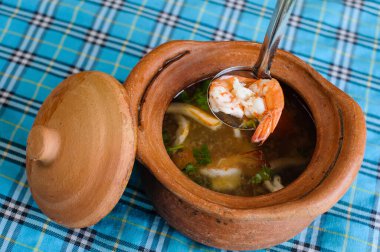 a Thai's spicy shimp soup with chilli paste called tomyam kung