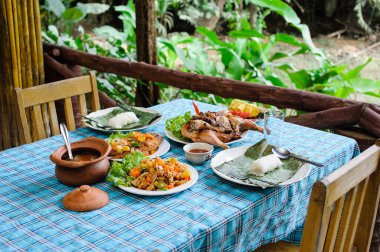 Thai style lunch set for two peoples in resort somewhere