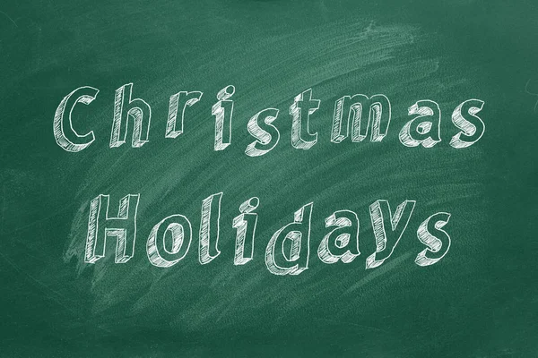 Hand drawing text Christmas holidays on green chalkboard