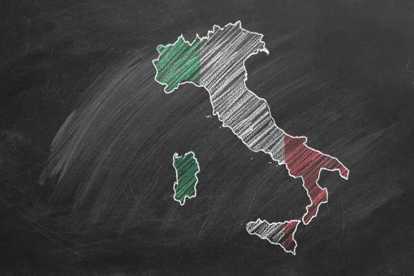 Country map and flag of Italy drawing with chalk on a blackboard. One of a large series of maps and flags of different countries. Education, travel, study abroad concept.