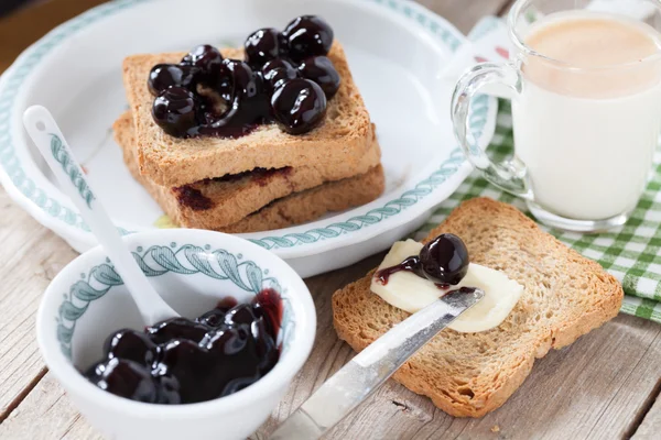 Breakfast With Sour Cherry Jam Milk And Rusks — Stock Photo, Image
