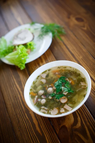 Vegetable soup with sausages in a plate — Stock Photo, Image