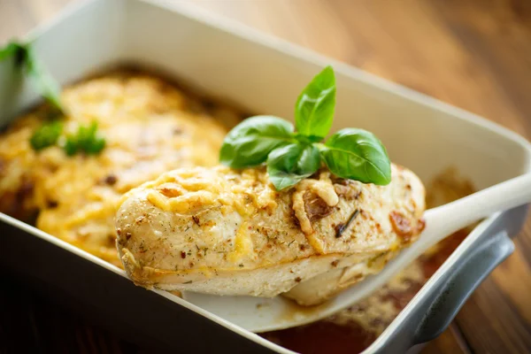 Chicken baked with cheese and spices — Stock Photo, Image