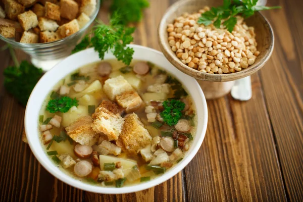 Pea soup with croutons — Stock Photo, Image