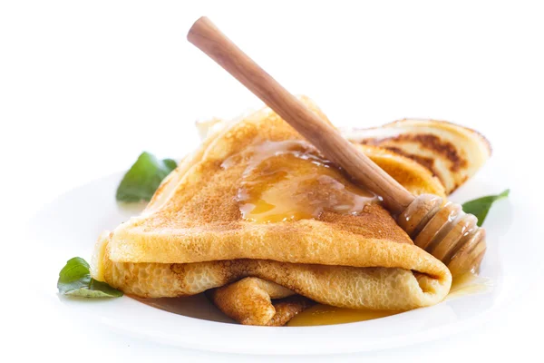 Thin pancakes with honey — Stock Photo, Image