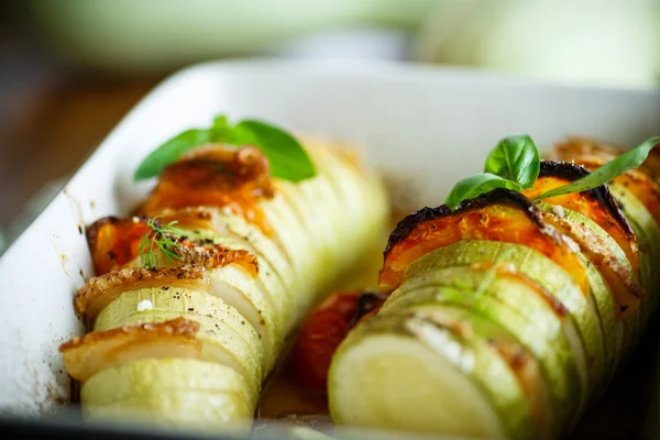 Baked zucchini stuffed with vegetables