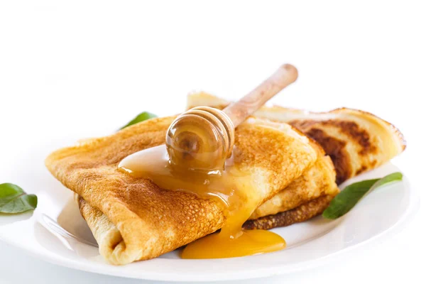 Thin pancakes with honey — Stock Photo, Image