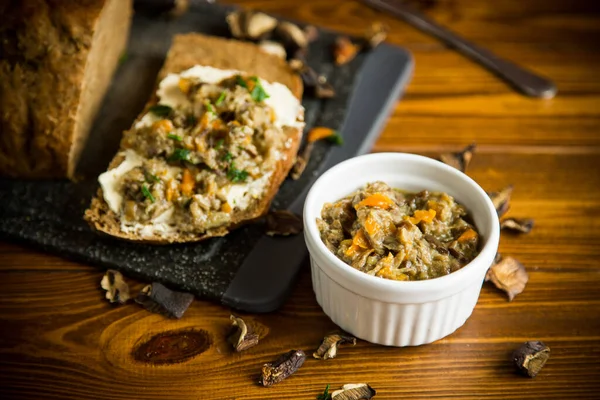 Home cooked natural mushroom caviar from forest dried mushrooms on a wooden table — Stock Image Home Cooked Natural Mushroom Caviar Forest Dried Mushrooms Wooden Table Royalty Free Stock Photos