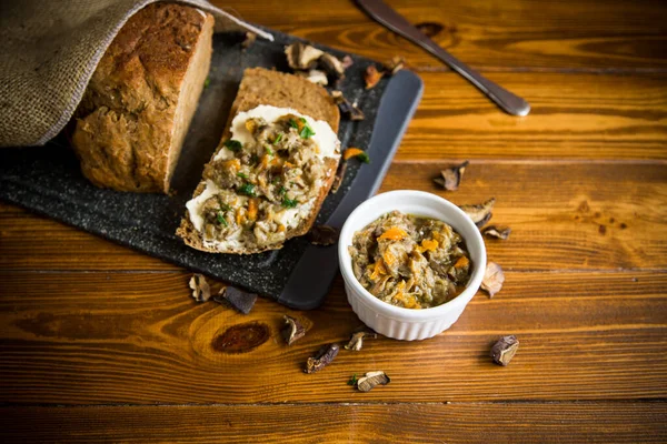 Home cooked natural mushroom caviar from forest dried mushrooms on a wooden table — Stock Image Home Cooked Natural Mushroom Caviar Forest Dried Mushrooms Wooden Table Royalty Free Stock Images