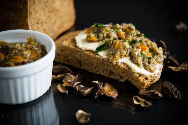 Home cooked natural mushroom caviar from forest dried mushrooms isolated on black background — Stock Image Home Cooked Natural Mushroom Caviar Forest Dried Mushrooms Isolated Black Royalty Free Stock Photos